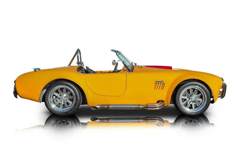 An incredible side shot photo of aShelby Cobra that you should buy.