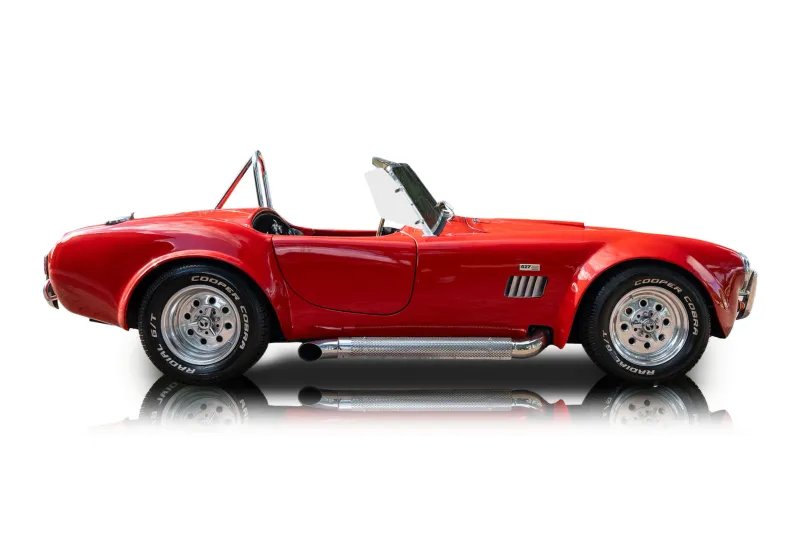An incredible side shot photo of aShelby Cobra that you should buy.