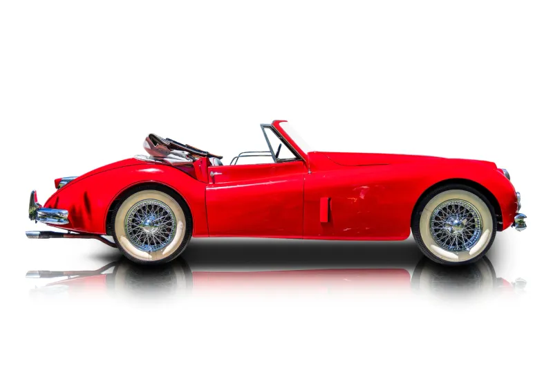 An incredible side shot photo of aJaguar XK140 that you should buy.