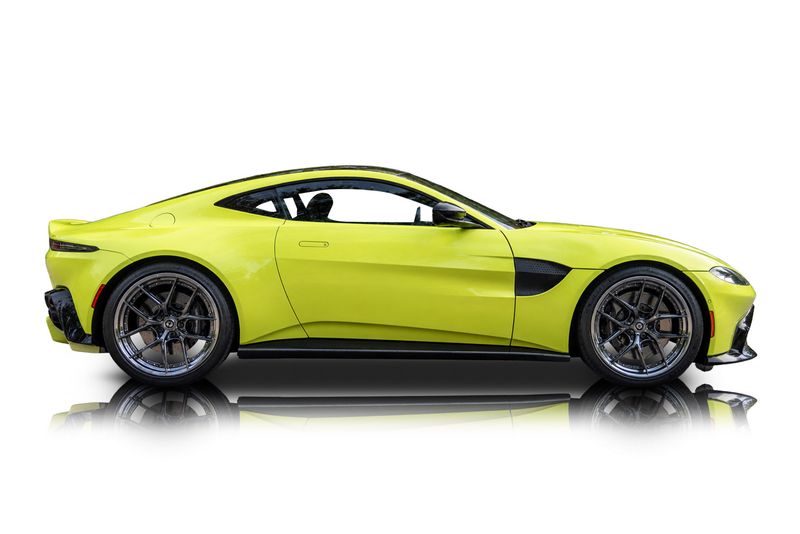 An incredible side shot photo of aAston Martin Vantage that you should buy.
