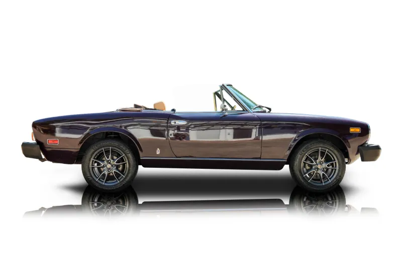 An incredible side shot photo of aFiat 124 Spider that you should buy.