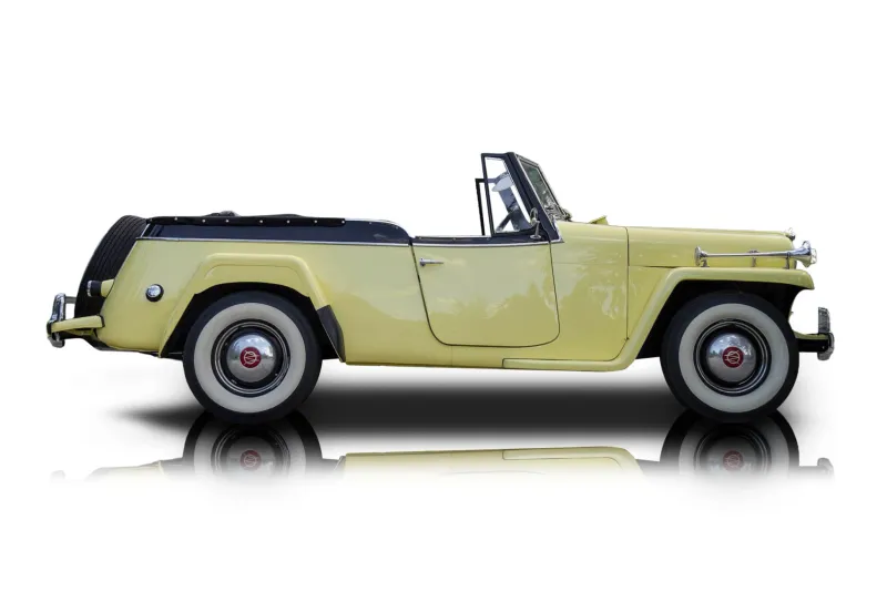 An incredible side shot photo of aWillys Jeepster that you should buy.