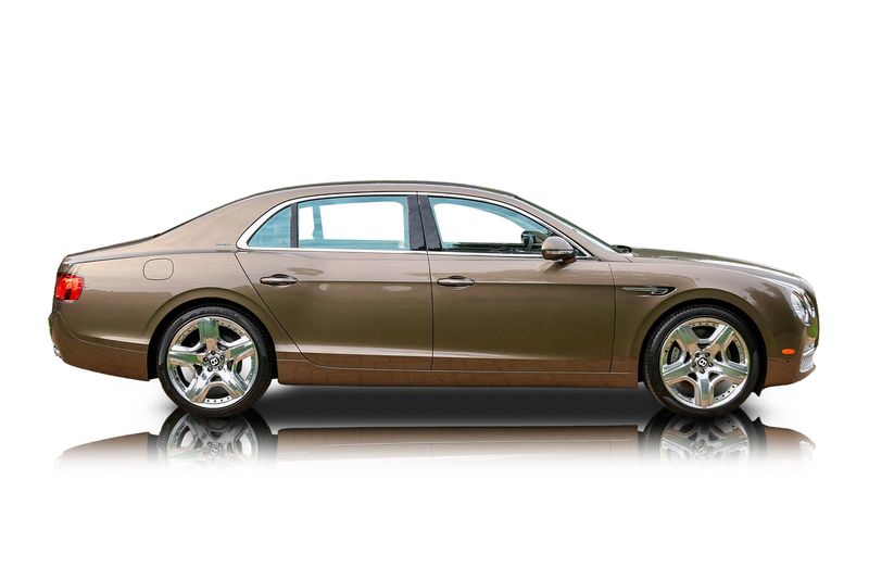 An incredible side shot photo of aBentley Flying Spur that you should buy.