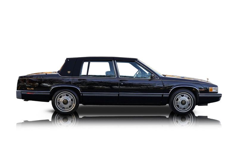 An incredible side shot photo of aCadillac DeVille that you should buy.