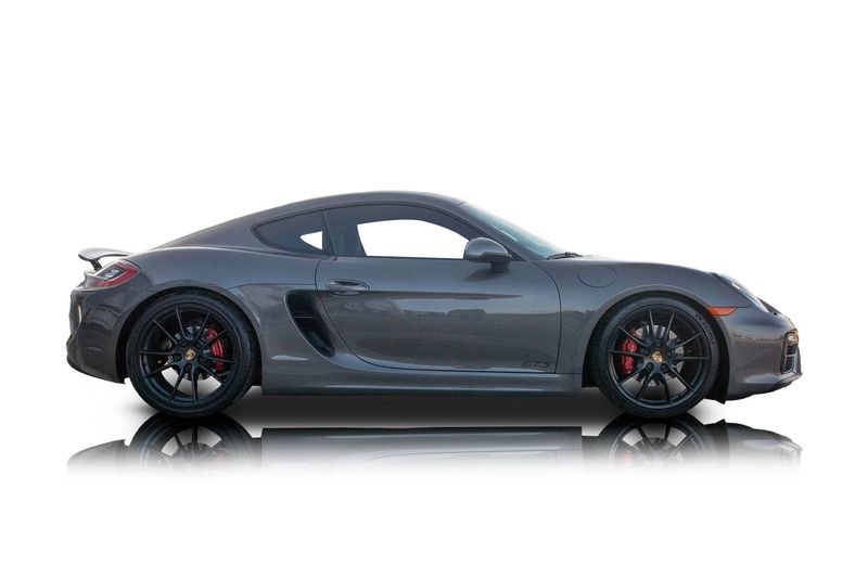 An incredible side shot photo of aPorsche Cayman that you should buy.
